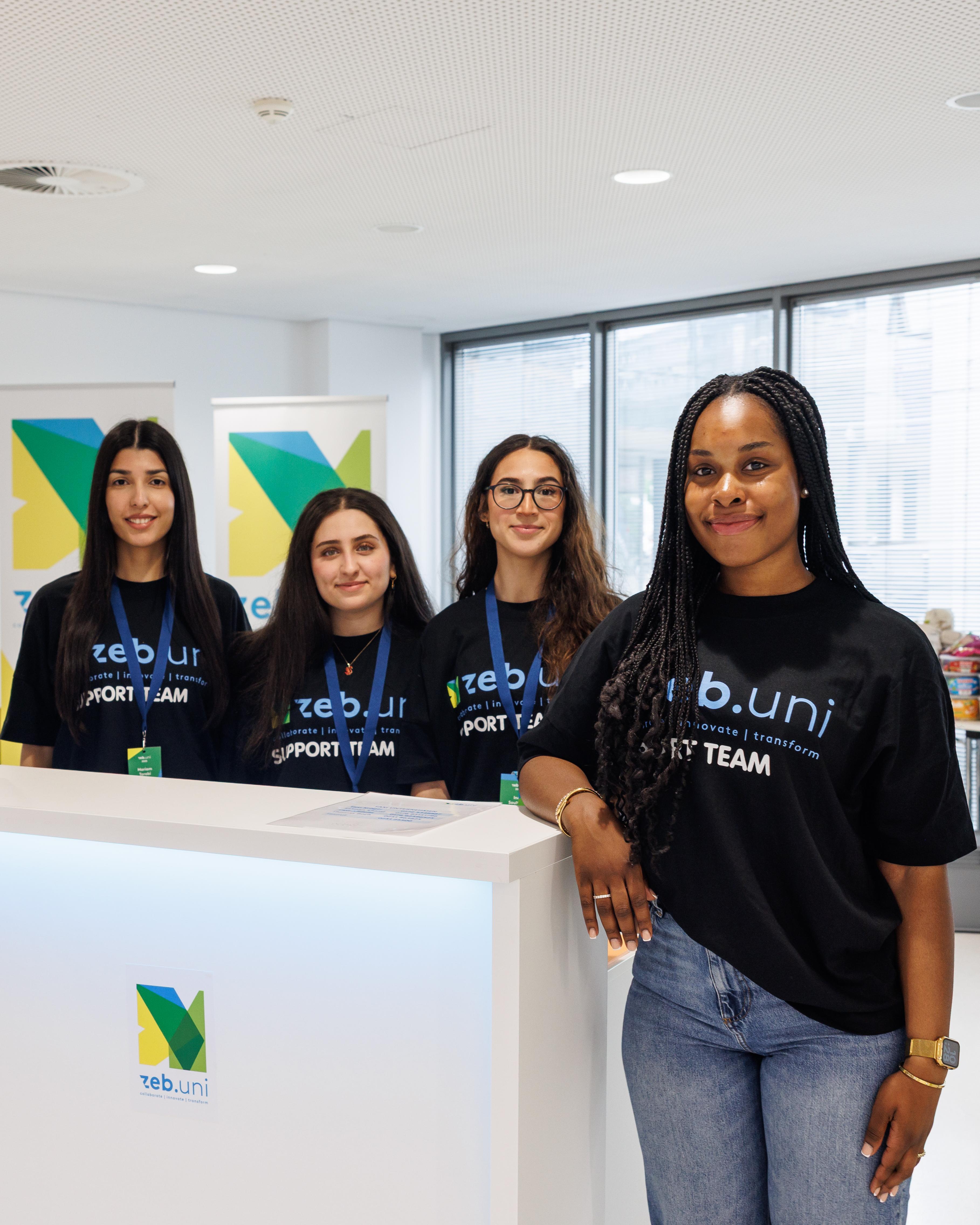 A group stands behind an information counter