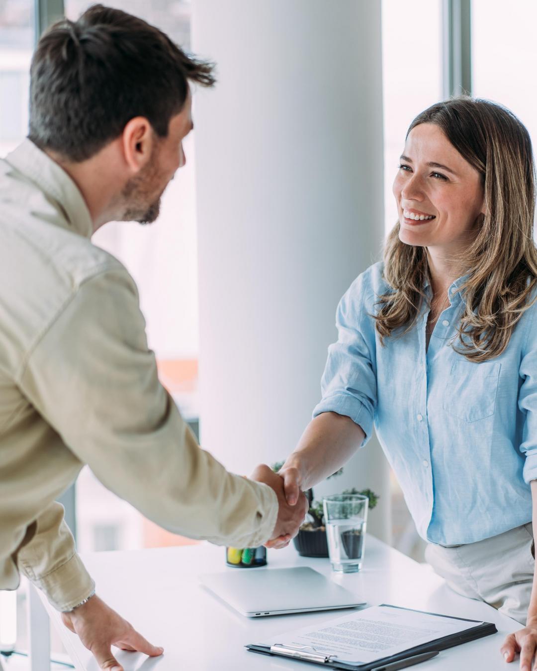 Handshake between a man and a woman.