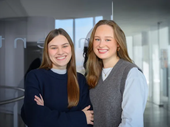 two women smiling at camera