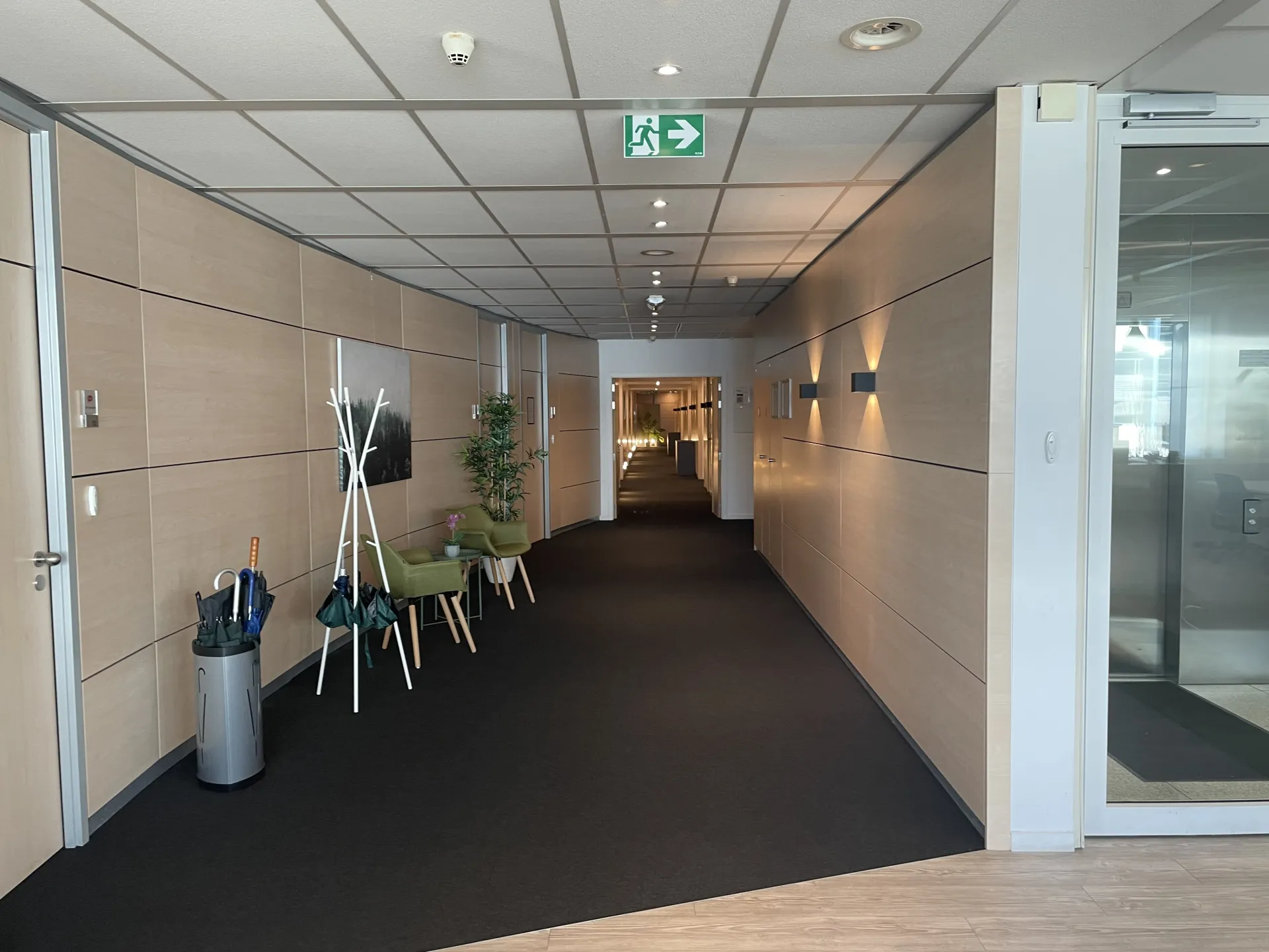 a hallway with a door and a sign