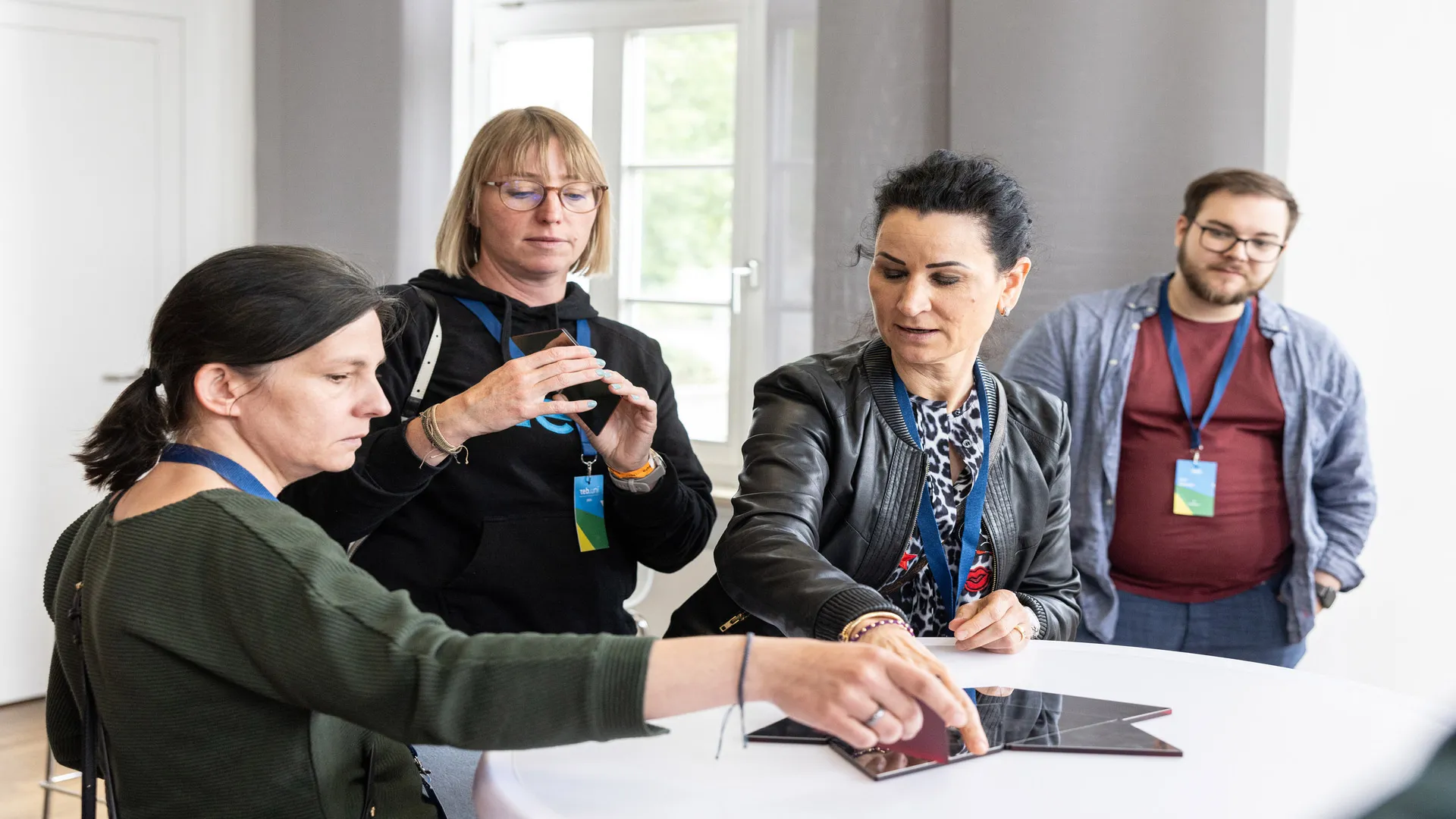 A group of people conversing at a table