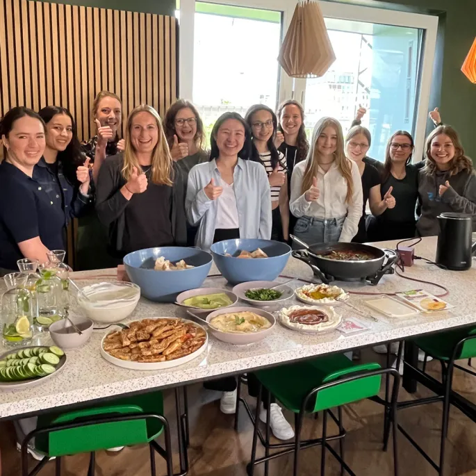 A group of women is posing for a photo