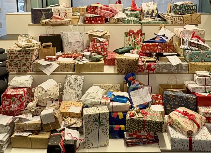 Several gifts arranged on a shelf