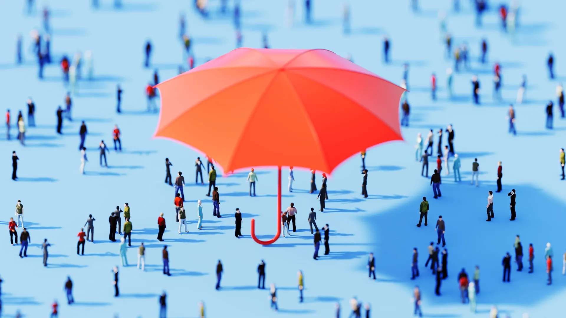 Eine Gruppe von Menschen, die unter einem Regenschirm stehen