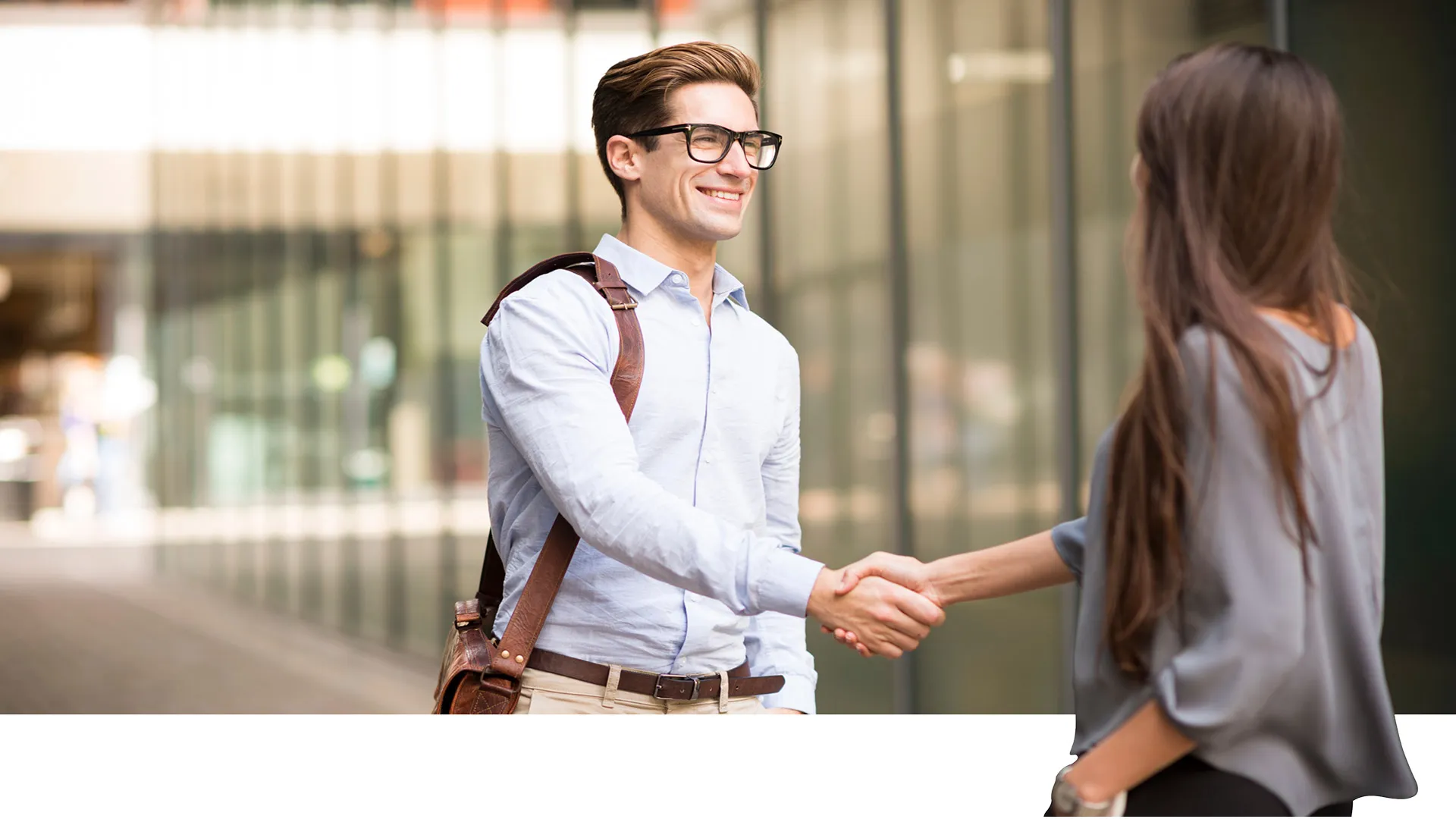 A man and a woman are shaking hands