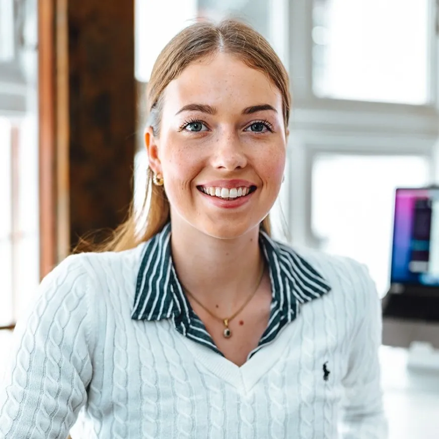 a woman smiling at camera
