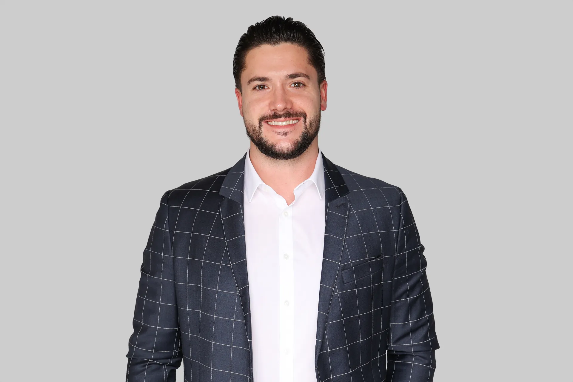 A men is smiling into the camera