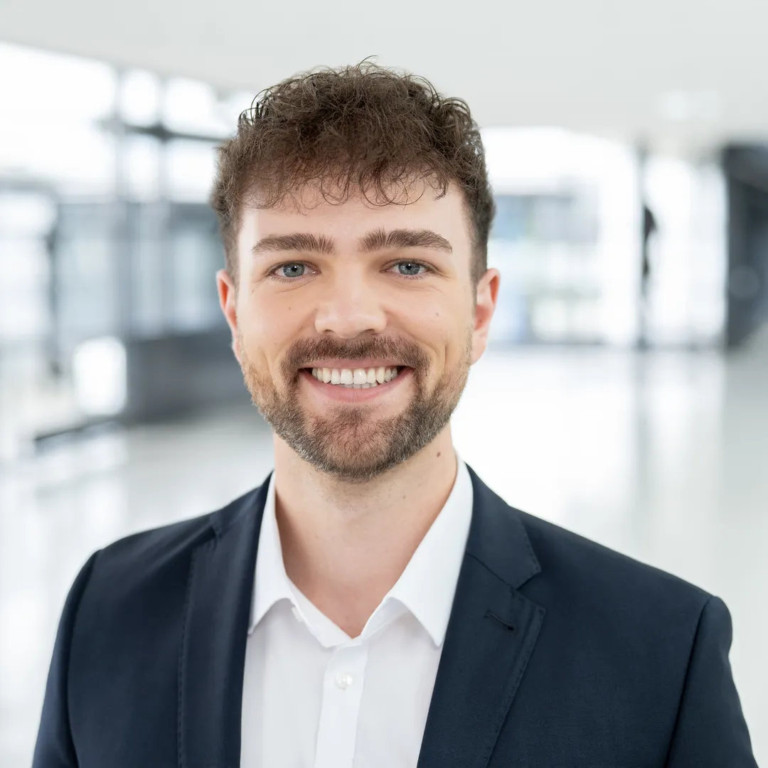 a man smiling at camera