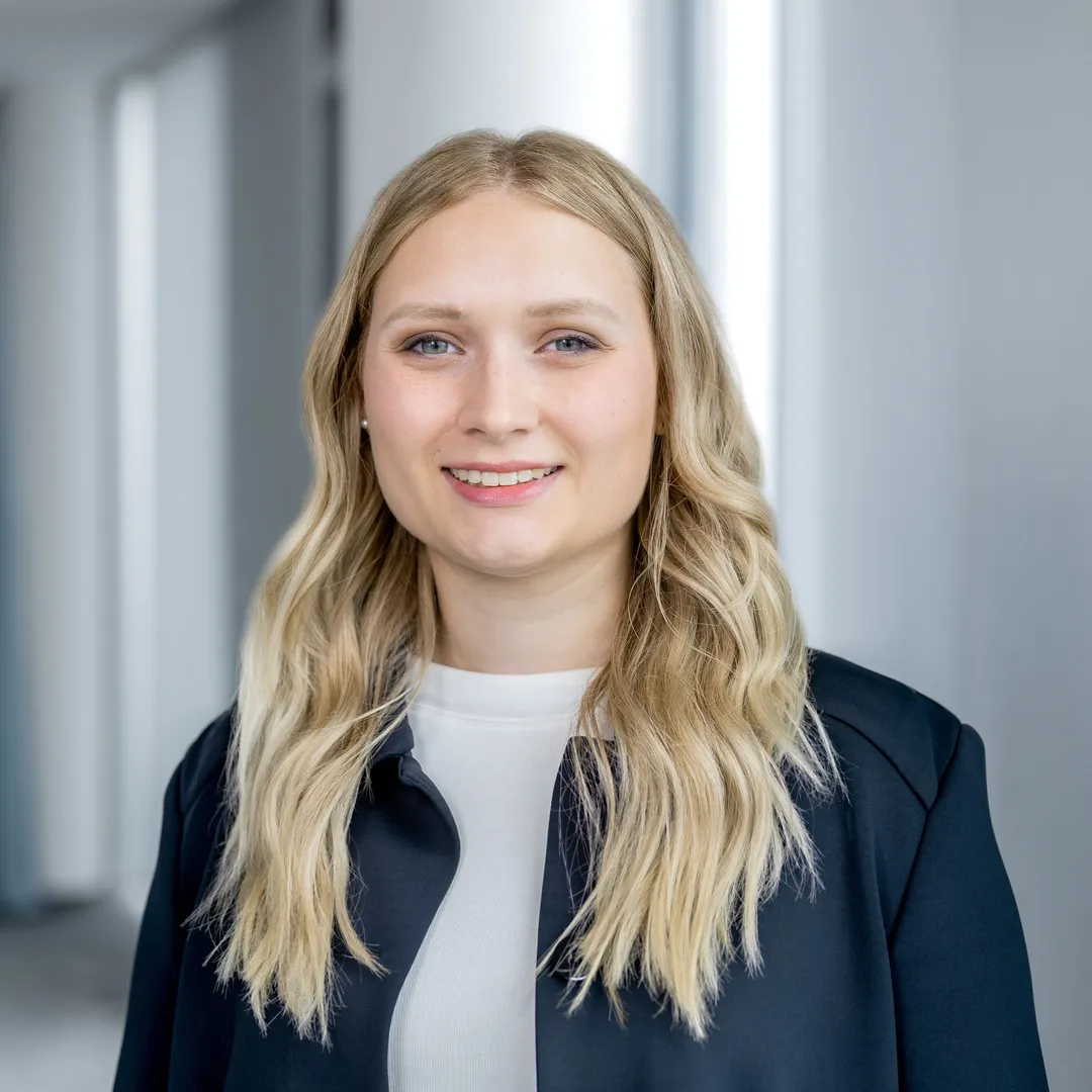 a woman with blonde hair smiling